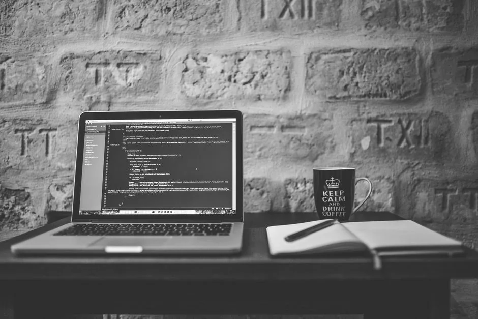 A tablet with a financial website open, alongside a white keyboard and mouse. Ideal for tech-theme stock images.